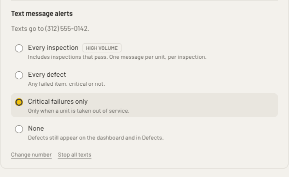After confirming: the number texts go to, a choice of every inspection, every defect, critical failures only or none, and links to change the number or stop all texts.